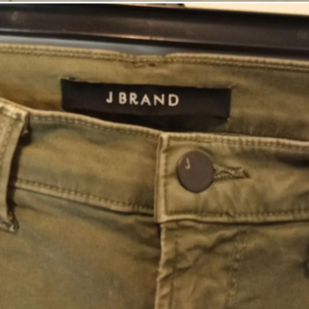 J brand olive green Jungle jeans distressed knees raw edge